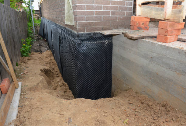 SJ Waterproofing Pros technician performing targeted Basement Waterproofing assessment in Sicklerville, NJ
